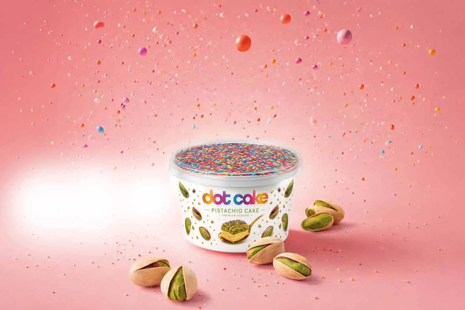 Dot Cake Pistachio – white cup with colourful sugar sprinkles and pistachios