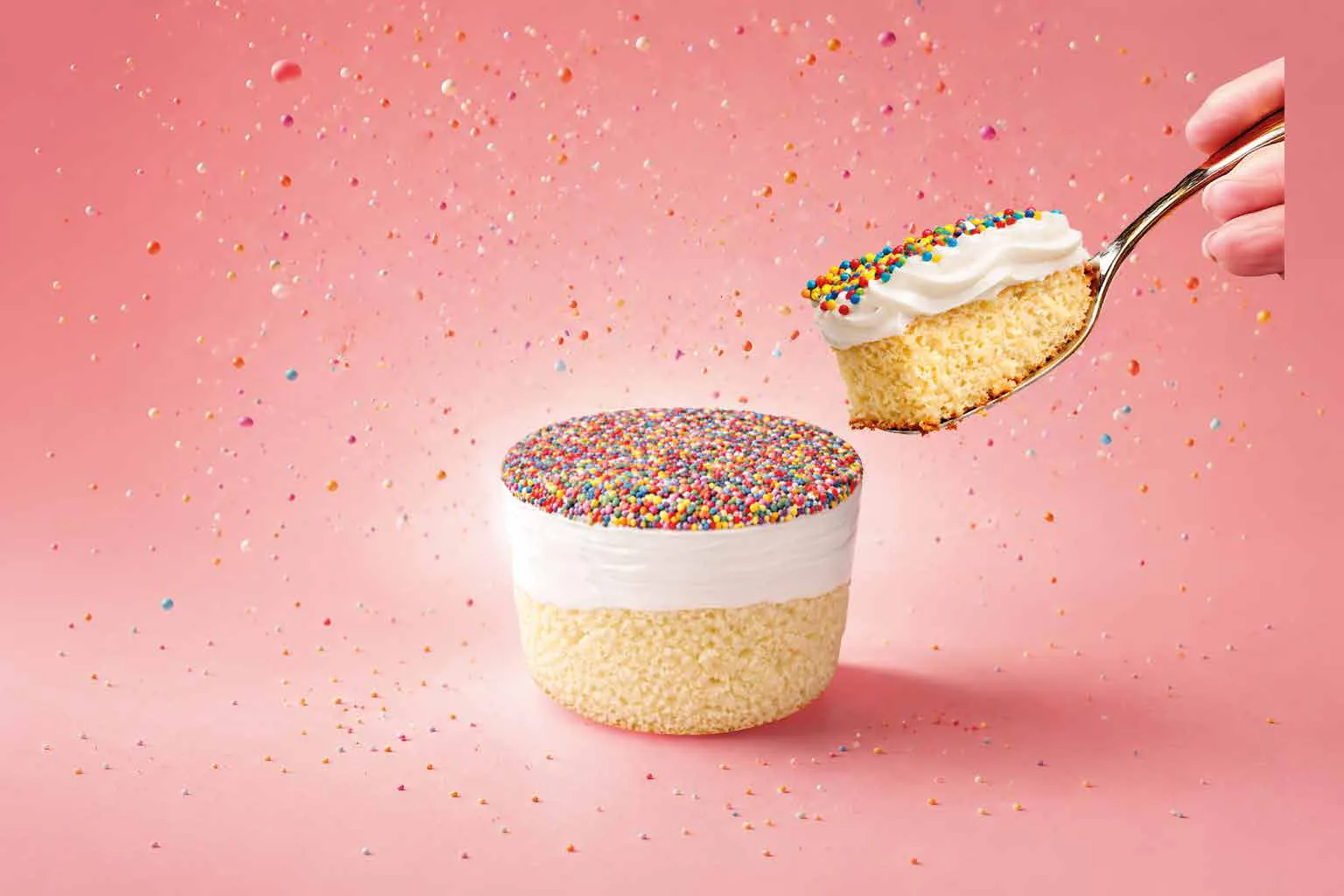 Dot Cake Vanilla cut open – spoon with sprinkles, vanilla cream and light sponge