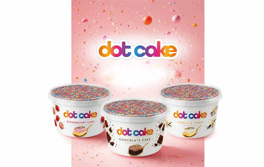 The Dot Cake trio – Strawberry, Chocolate and Vanilla cups against a pink confetti background